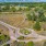 a road with a circular road and trees on the side