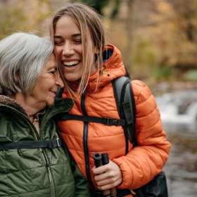 A beautiful community at the heart of all your passions a couple of women smiling while hiking