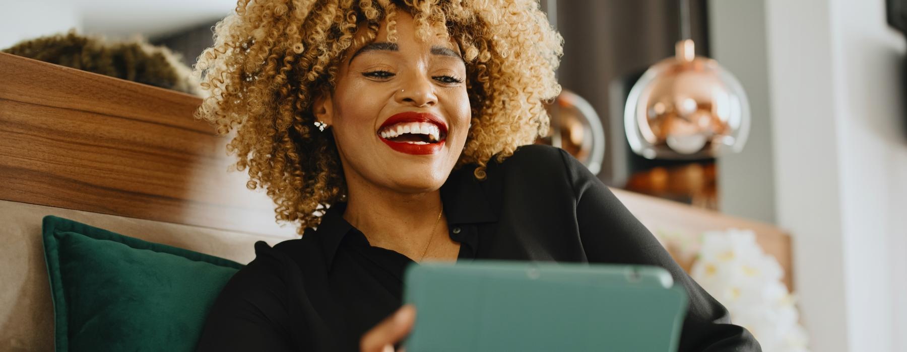 a woman holding a laptop