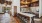 a kitchen with a bar and stools