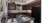 a kitchen with dark wood cabinets