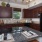 a kitchen with dark wood cabinets
