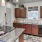 a kitchen with wooden cabinets