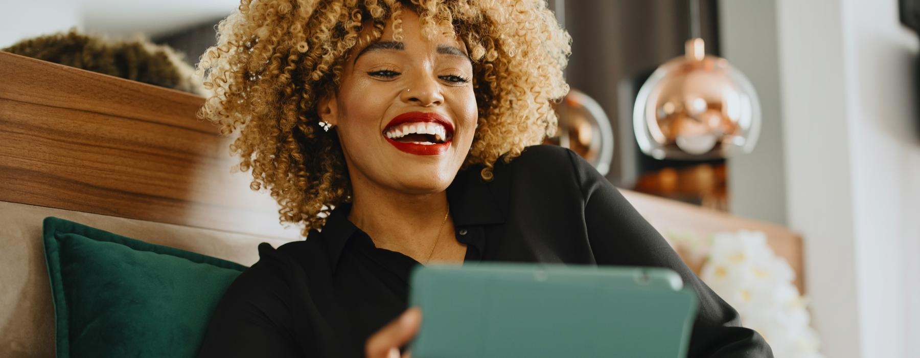 a woman holding a laptop