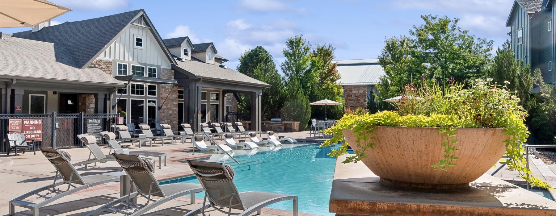 a pool with chairs around it
