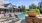 a pool with chairs around it