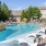 a swimming pool with chairs around it