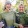 a couple of women holding plants
