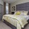 a bedroom with a bed and lamps
