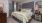 a bedroom with a bed and lamps