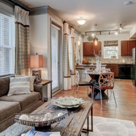 Spacious and well-lit living spaces a living room with a couch and a table