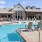 a swimming pool with chairs around it