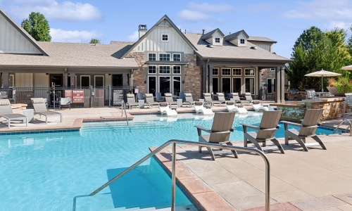 Find your perfect fit at Berkshire Aspen Grove a swimming pool with chairs around it